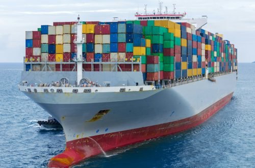 Front of Cargo container ship carrying container and running in international container